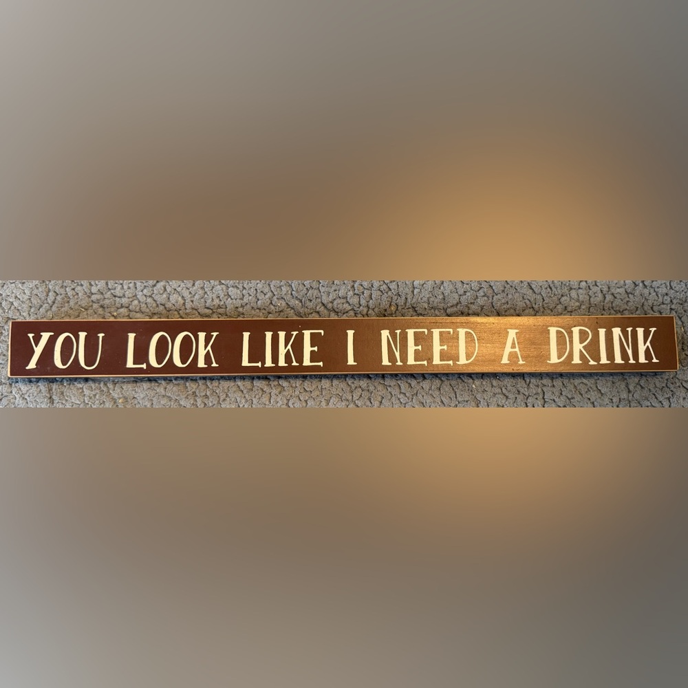 Brown Wooden Sign with White Text